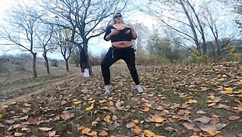 A Milf With A Beautiful Body And Large Breasts Plays In A Public Park Near A Lake